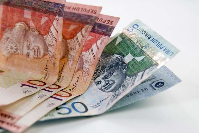 Ringgit slides past 4.00 vs USD